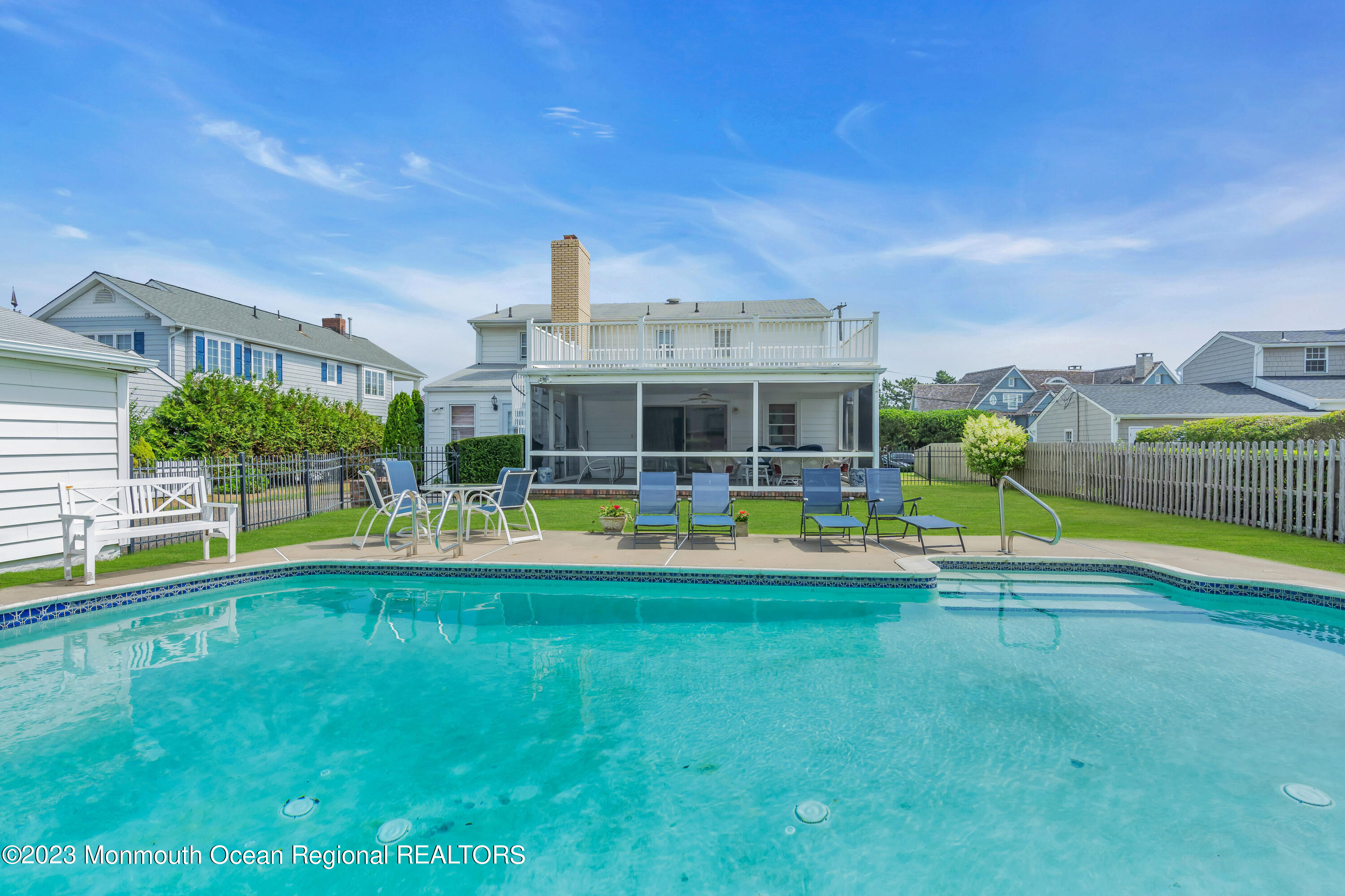 7 Howell Avenue Spring Lake, NJ 07762 - Photo 46 of 52 a view of swimming pool with lawn chairs and large trees