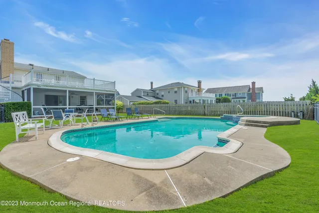 a view of a swimming pool with a patio