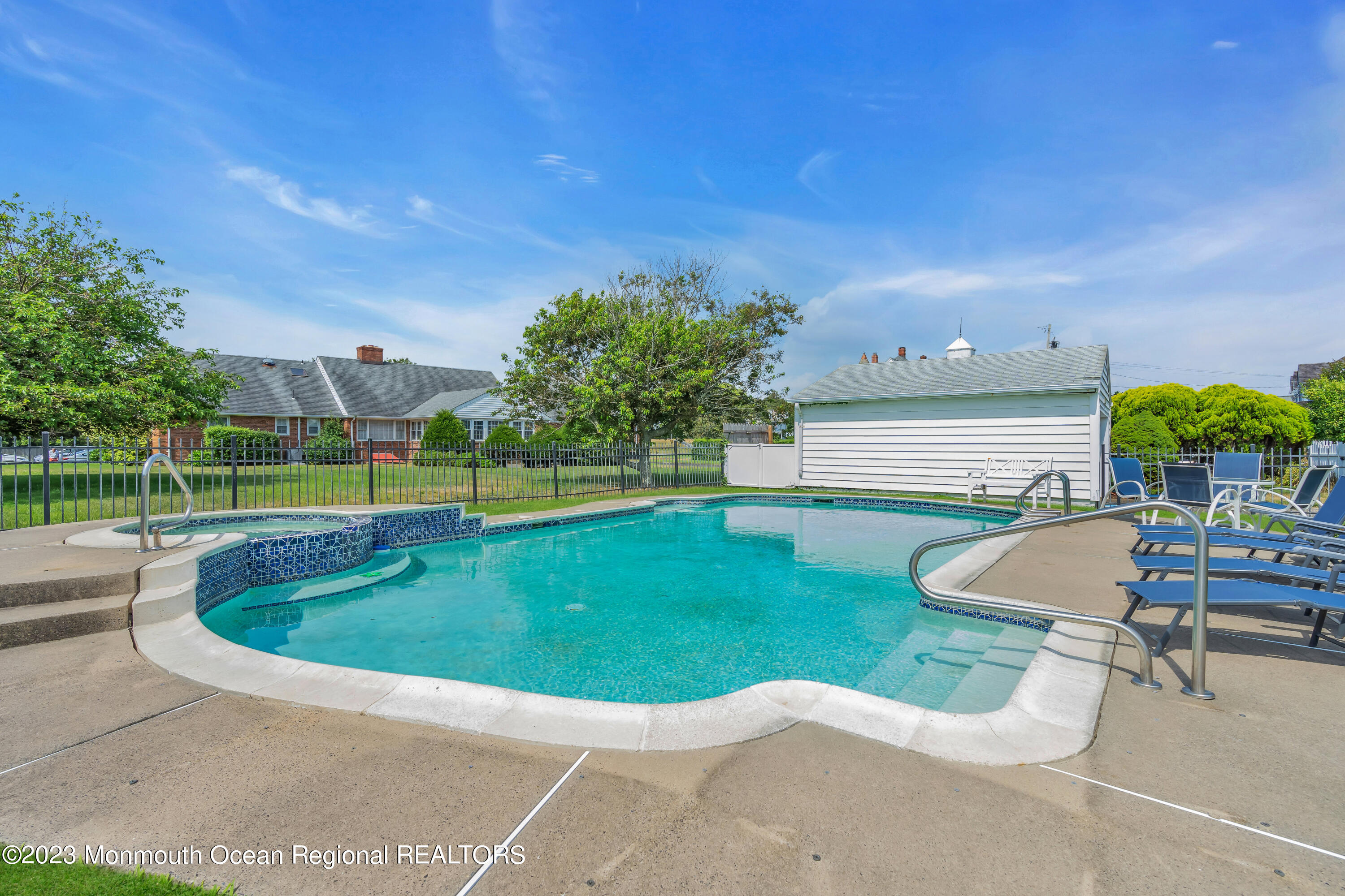 7 Howell Avenue Spring Lake, NJ 07762 - Photo 49 of 52 a view of a swimming pool with a patio