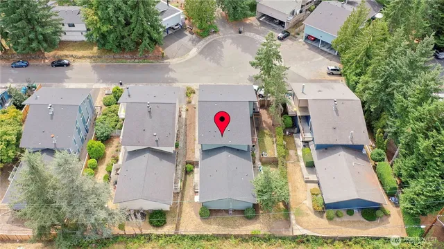 an aerial view of residential houses with outdoor space