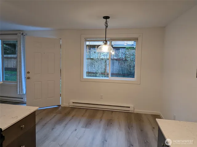 a view of a backyard with barn and large trees