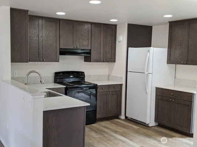 a kitchen with a sink and cabinets