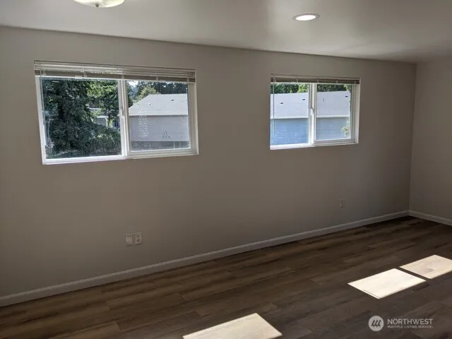 a kitchen with stainless steel appliances a stove a microwave and a refrigerator