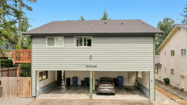 a aerial view of a house with table and chairs