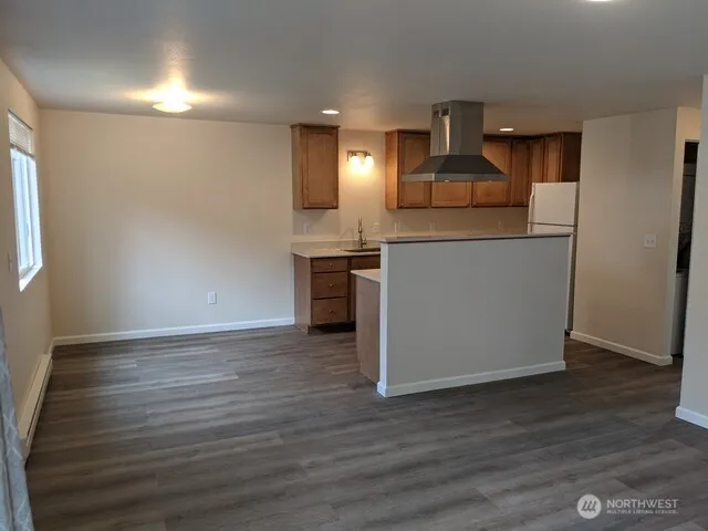 a kitchen with a stove and a refrigerator