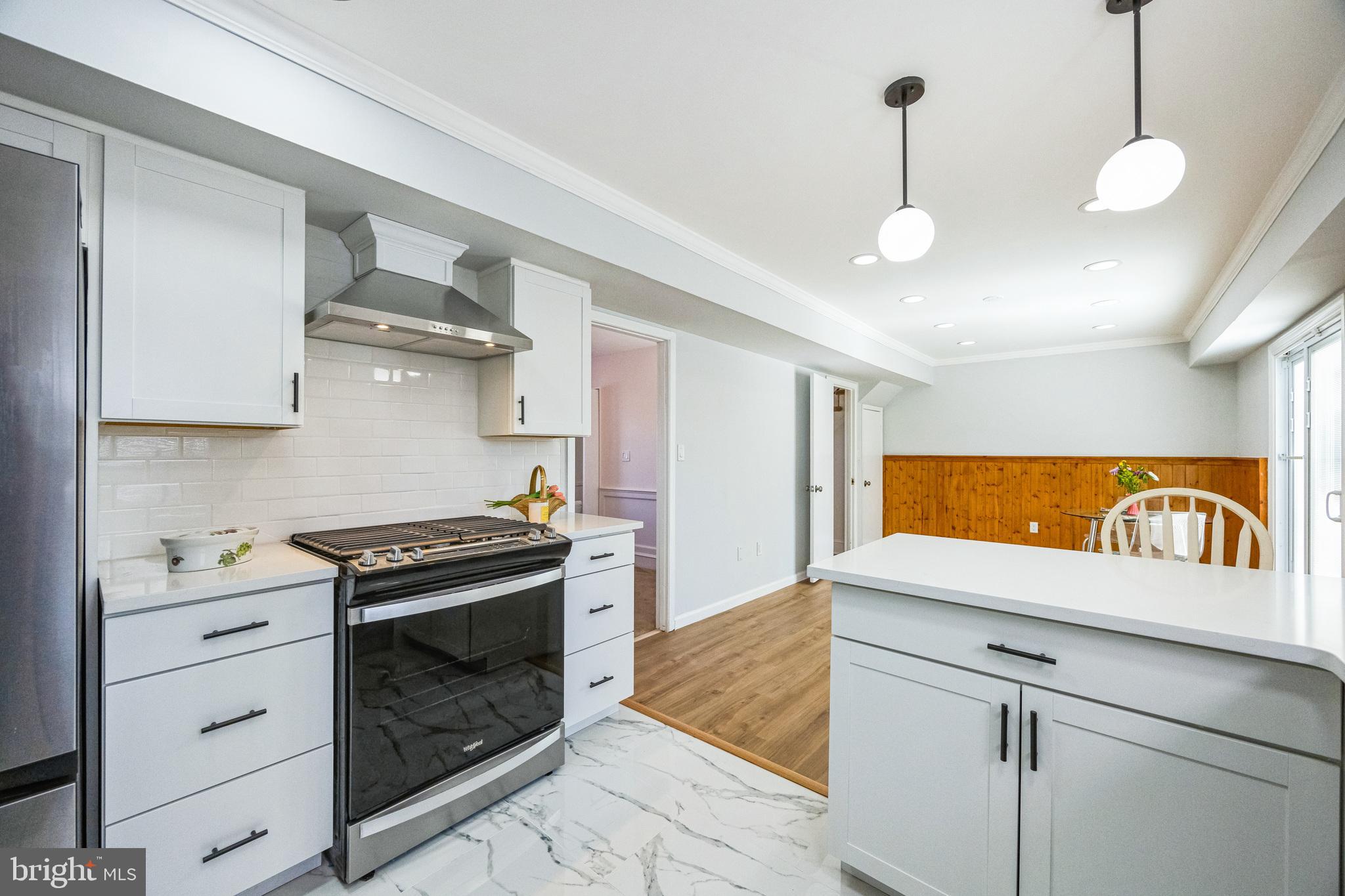 59 Manor Lane Willingboro, NJ 08046 - Photo 11 of 28 a kitchen with stainless steel appliances granite countertop a stove and a sink
