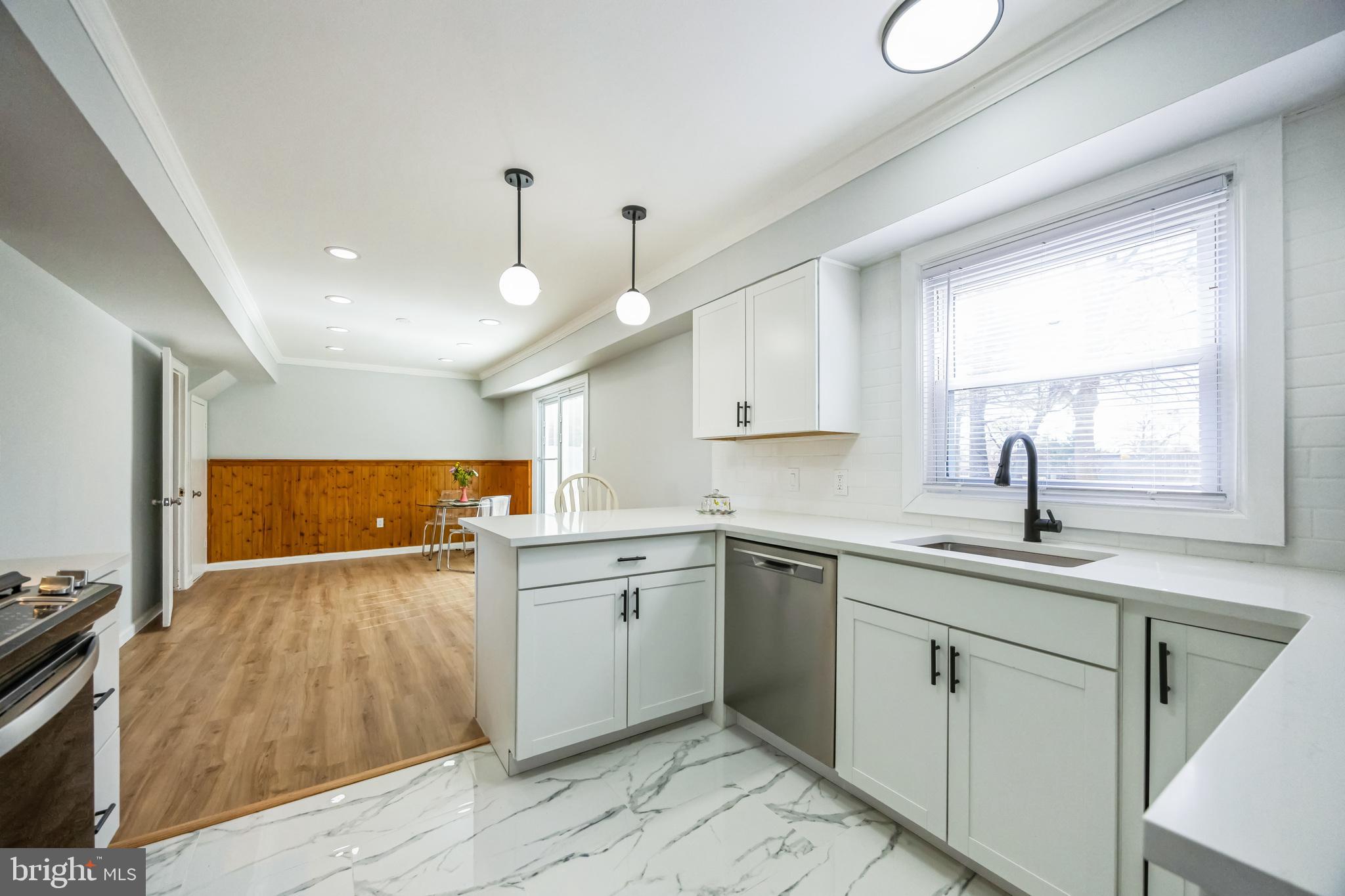 59 Manor Lane Willingboro, NJ 08046 - Photo 14 of 28 a kitchen with a sink window and cabinets
