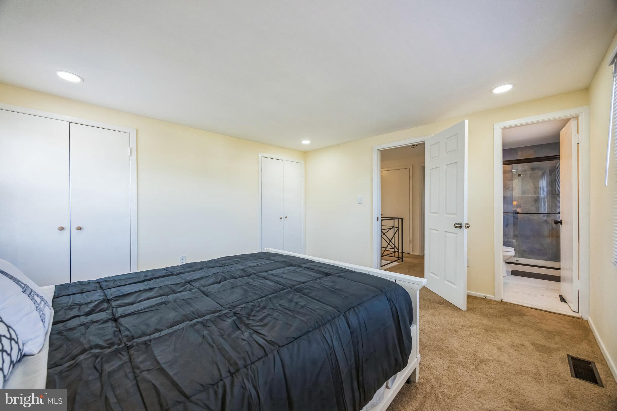 59 Manor Lane Willingboro, NJ 08046 - Photo 18 of 28 a spacious bedroom with a bed and cabinet