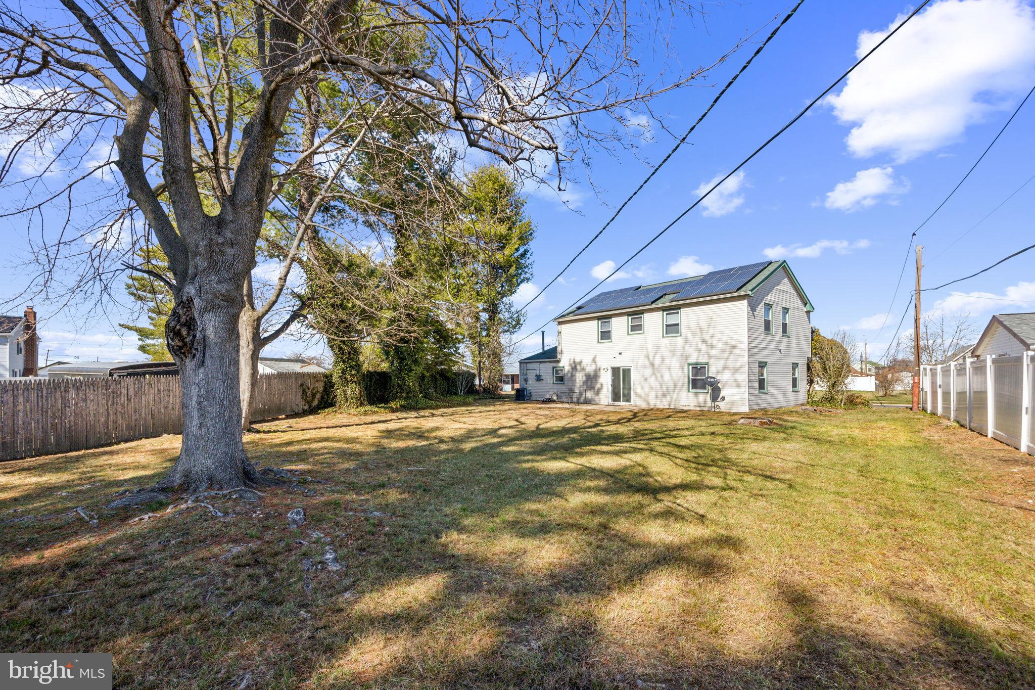 59 Manor Lane Willingboro, NJ 08046 - Photo 2 of 28 a big yard with large trees
