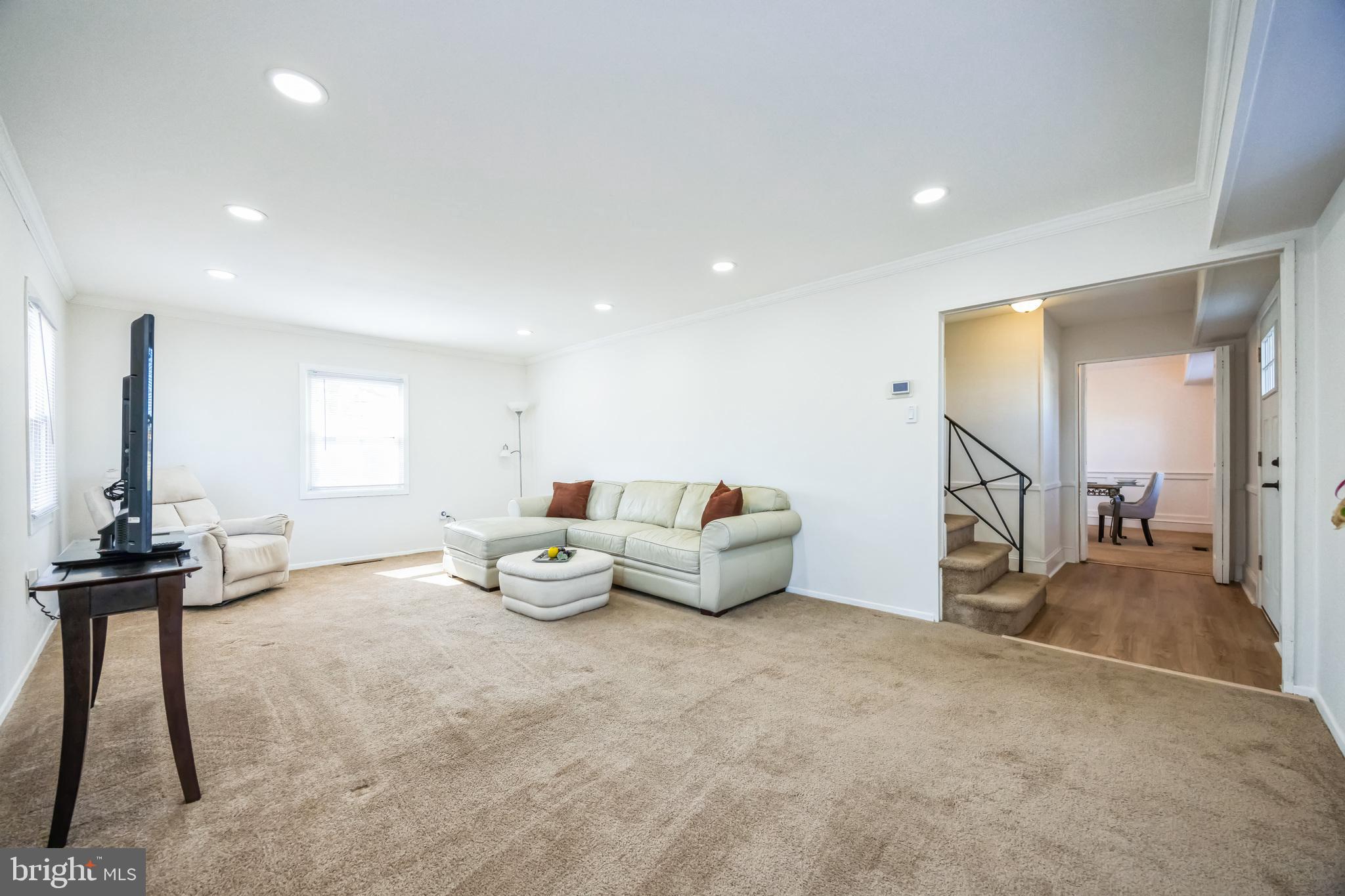 59 Manor Lane Willingboro, NJ 08046 - Photo 5 of 28 a living room with furniture and a flat screen tv
