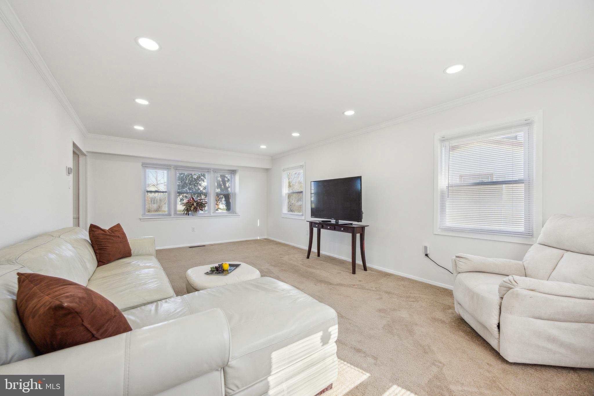 59 Manor Lane Willingboro, NJ 08046 - Photo 6 of 28 a living room with furniture and a flat screen tv