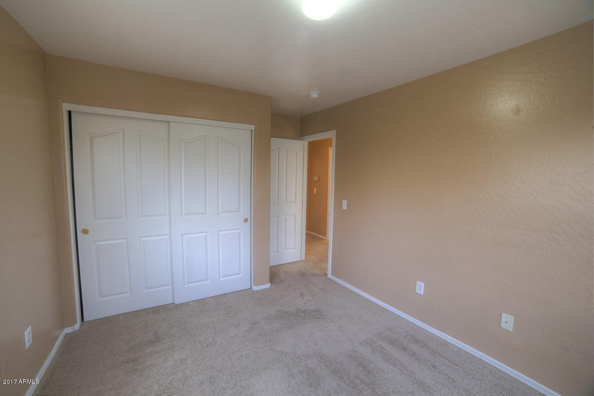 3902 West Carter Road Phoenix, AZ 85041 - Photo 31 of 38 a view of an empty room and closet area