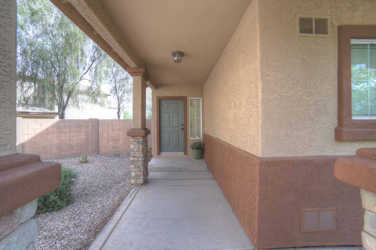 3902 West Carter Road Phoenix, AZ 85041 - Photo 36 of 38 a view of a porch