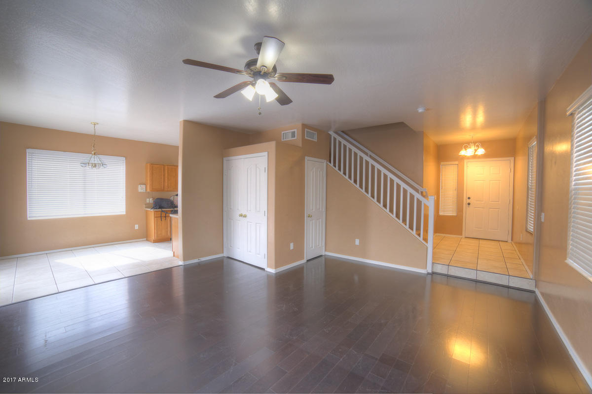 3902 West Carter Road Phoenix, AZ 85041 - Photo 5 of 38 a view of an entryway with wooden floor