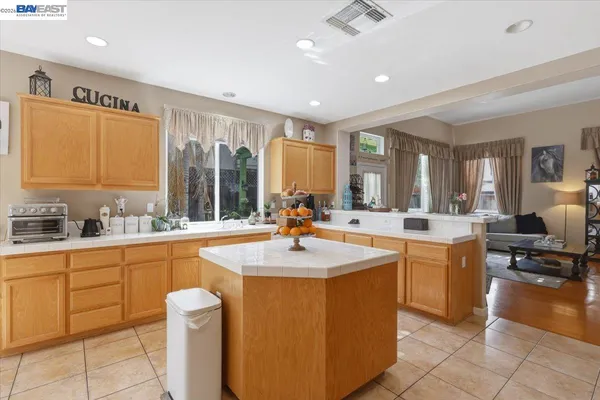 a kitchen with stainless steel appliances granite countertop a sink and cabinets
