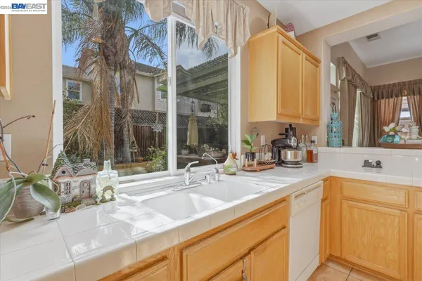 a view of a dining room with furniture large windows and wooden floor
