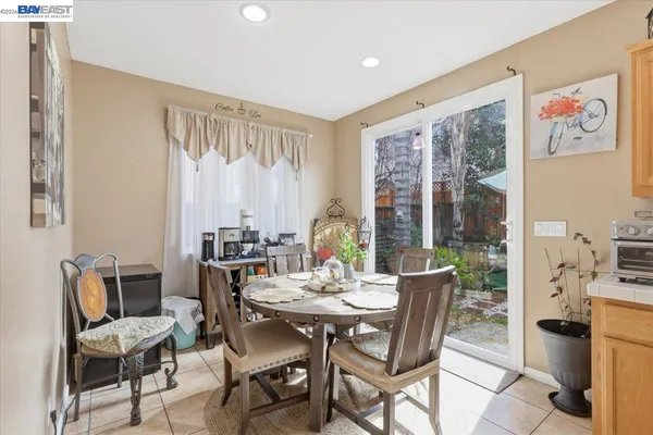 a white bath tub sitting next to a white sink