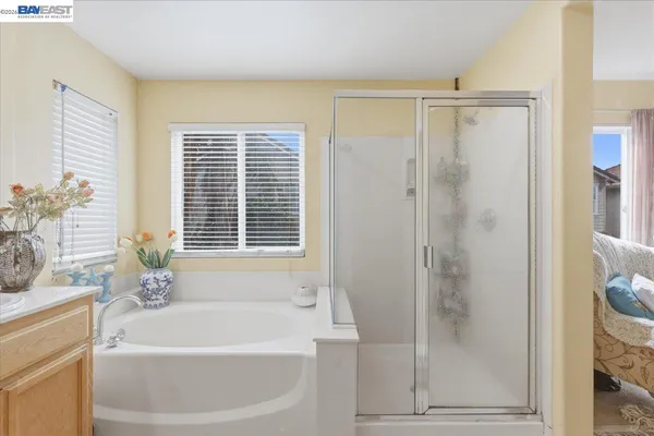 a bedroom with a bed and a flat tv screen