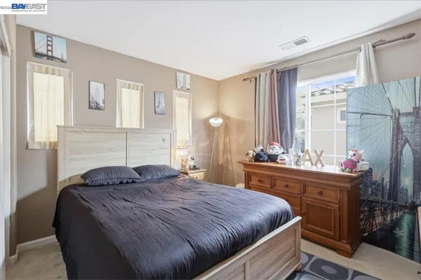 a bathroom with a double vanity sink mirror and shower
