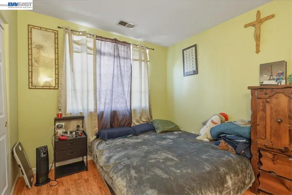 a view of a patio with table and chairs potted plants with wooden fence