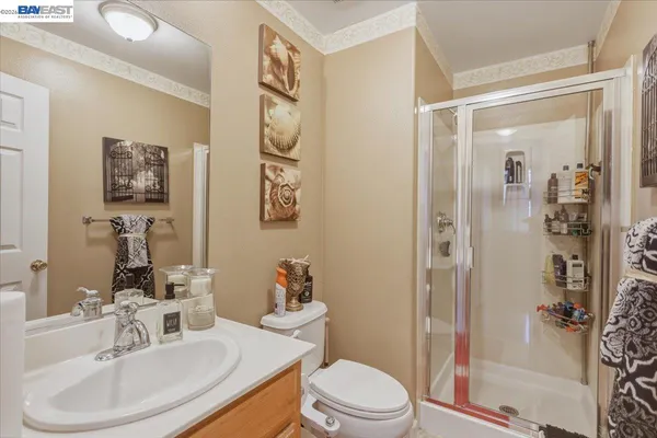 a view of a patio with table and chairs and potted plants
