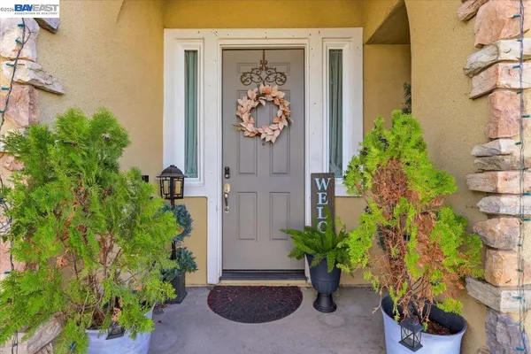 front view of a house with a potted plant
