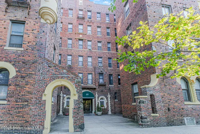 a front view of a building with garden