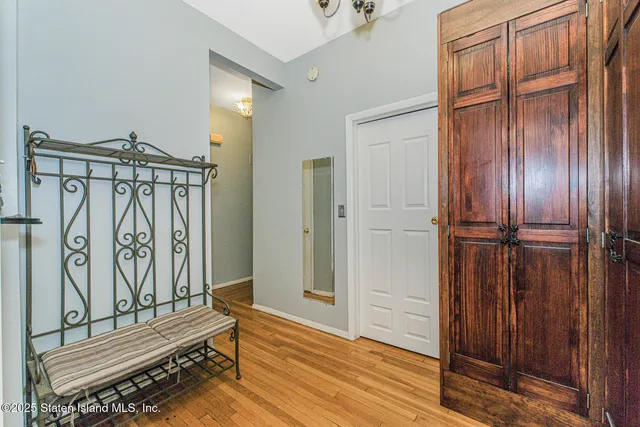 a view of an entryway with wooden floor
