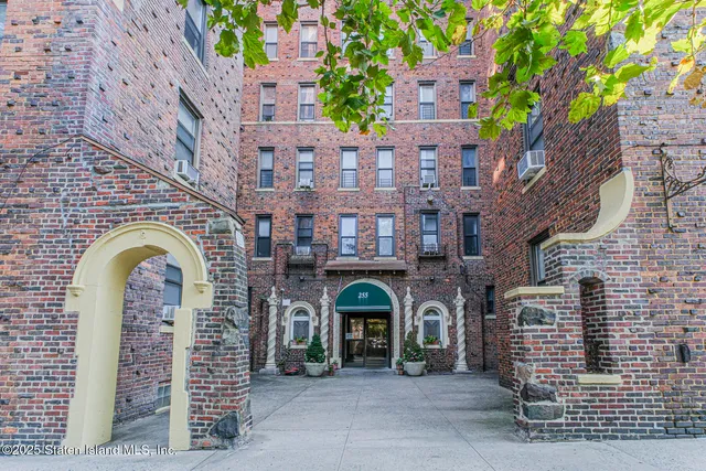 a front view of a building with glass windows