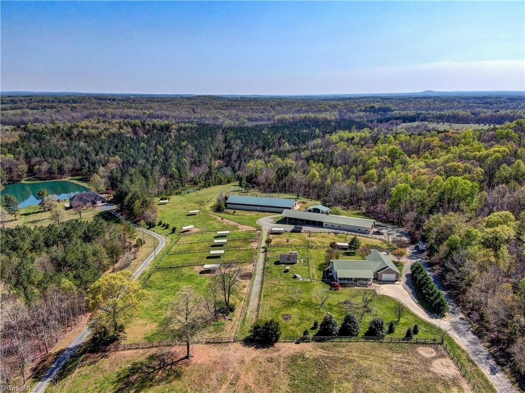 6010 Sandy Creek Church Road Staley, NC 27355 - Photo 2 of 38 Overview of house, large pastures with run ins, covered arena, round pen, storage shed, workshop, and barn