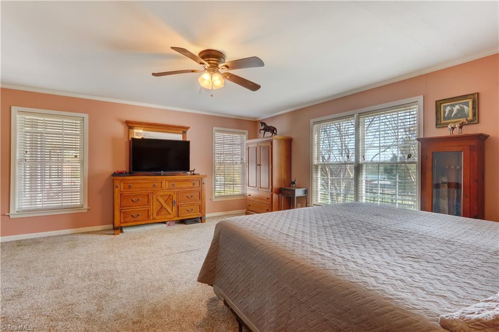 6010 Sandy Creek Church Road Staley, NC 27355 - Photo 14 of 38 Lots of natural light in the primary bedroom