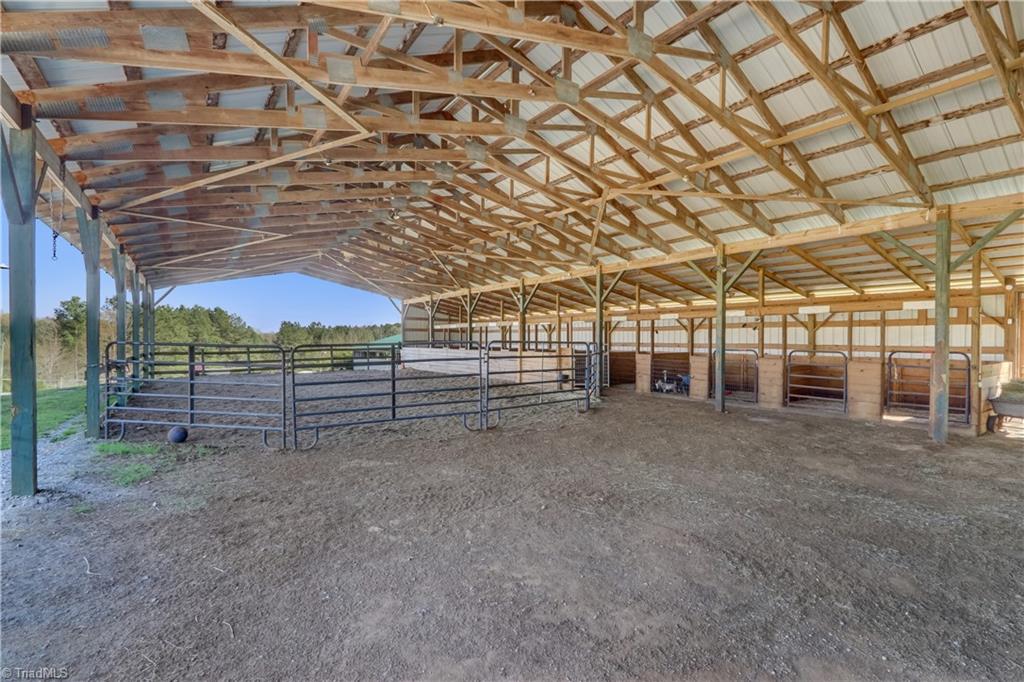 6010 Sandy Creek Church Road Staley, NC 27355 - Photo 29 of 38 Covered round pen with adjacent stalls