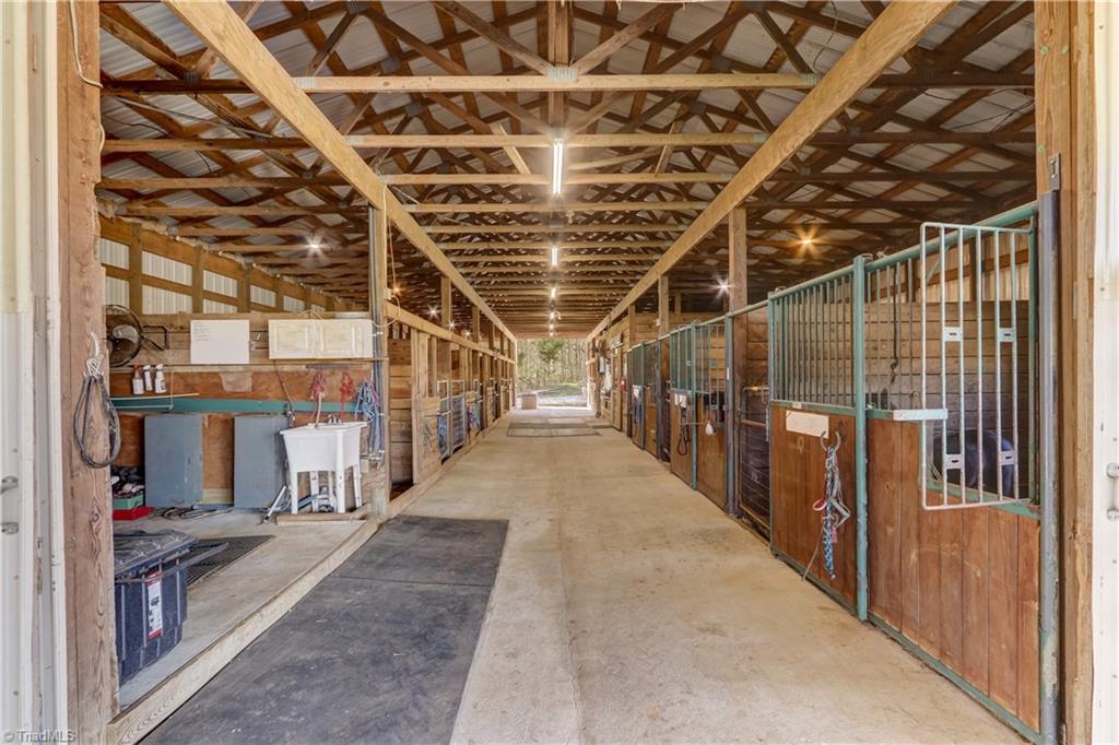 6010 Sandy Creek Church Road Staley, NC 27355 - Photo 30 of 38 Interior of barn with 11 12x12 stalls (8 of which have been converted to 6x12), 8 8x6 stalls, 2 12x8 stall