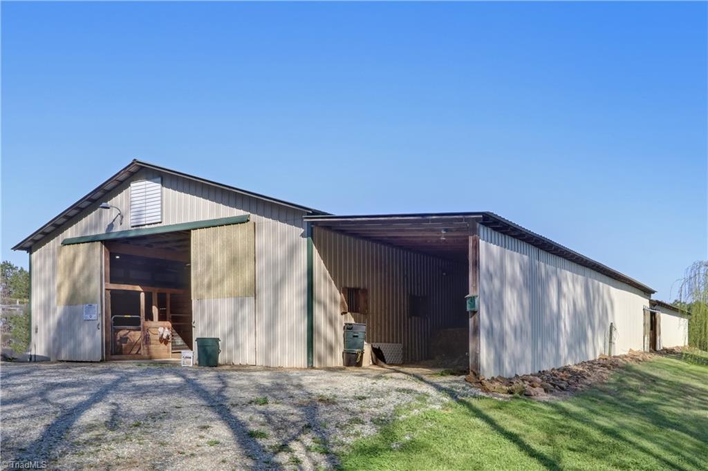 6010 Sandy Creek Church Road Staley, NC 27355 - Photo 34 of 38 Exterior barn with adjoining storage shed