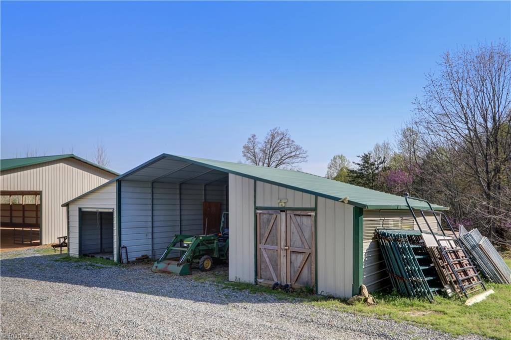 6010 Sandy Creek Church Road Staley, NC 27355 - Photo 35 of 38 Storage shed for farm equipment