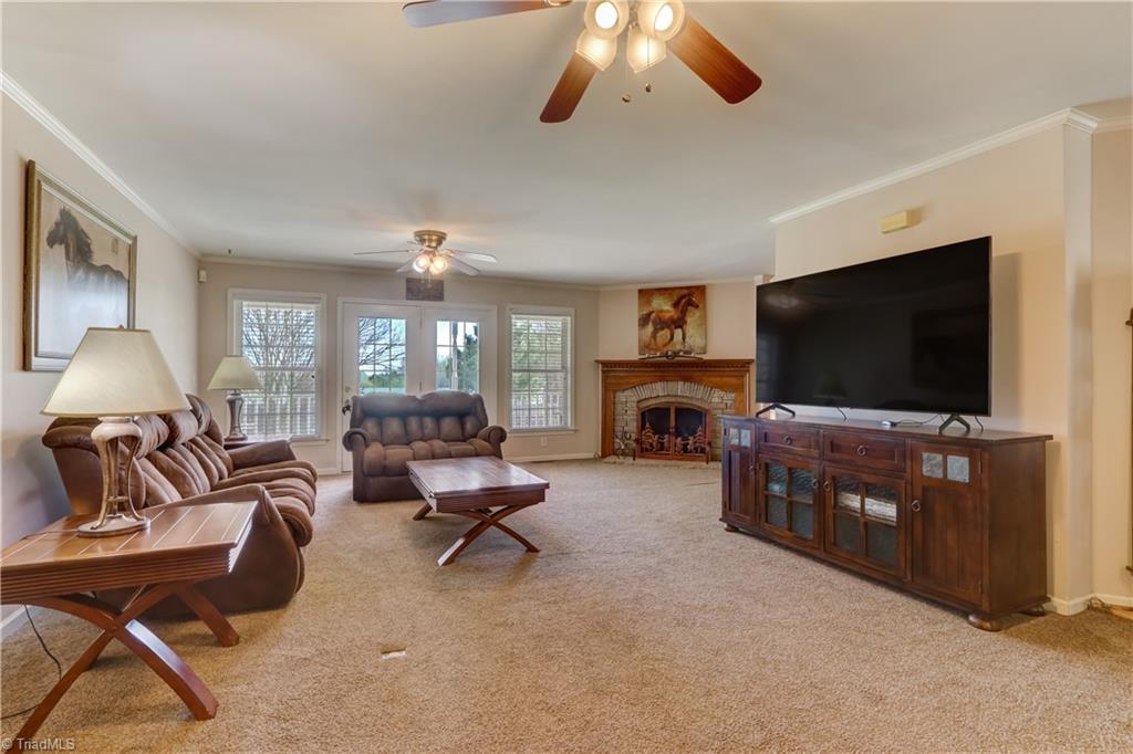 6010 Sandy Creek Church Road Staley, NC 27355 - Photo 6 of 38 Living area with tucked fireplace