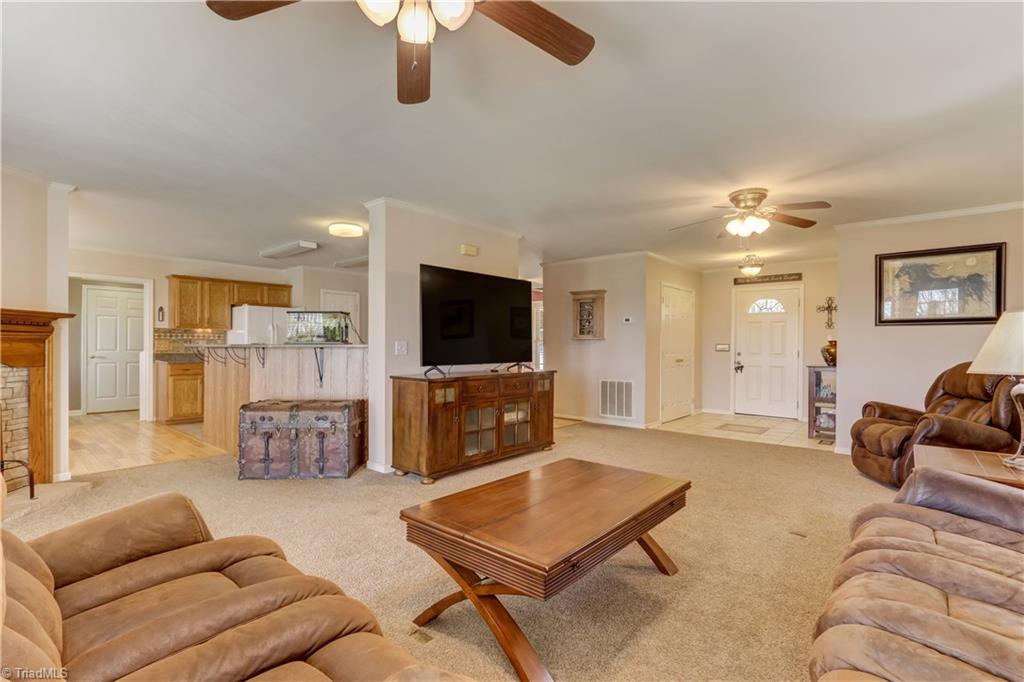 6010 Sandy Creek Church Road Staley, NC 27355 - Photo 8 of 38 Living room view flowing into kitchen island