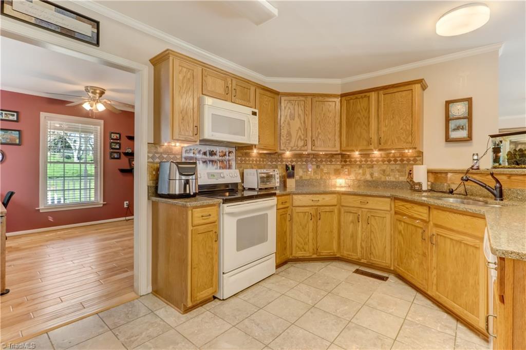 6010 Sandy Creek Church Road Staley, NC 27355 - Photo 9 of 38 Wrapped countertops and lots of kitchen storage
