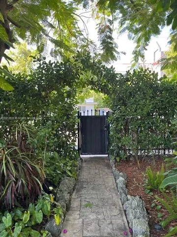 a view of bushes and pathway