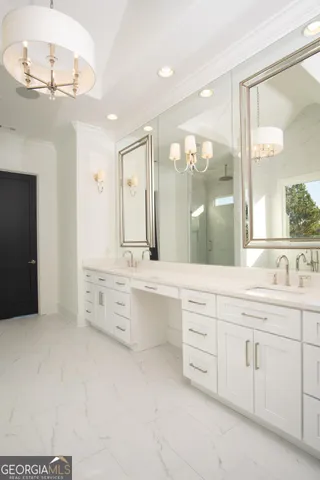 a bathroom with a granite countertop sink mirror and a