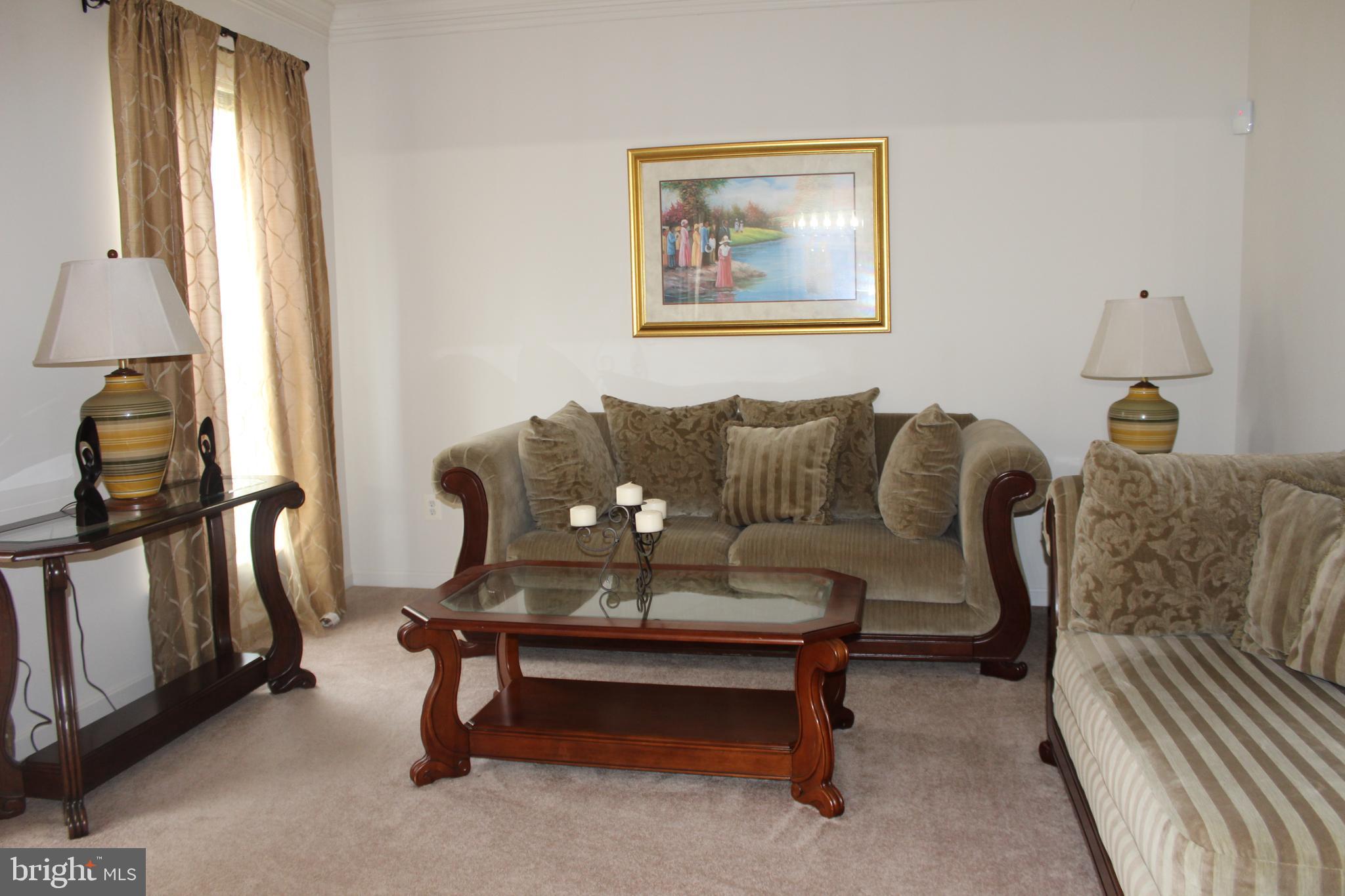 3470 Malcolm Road Brandywine, MD 20613 - Photo 11 of 55 a living room with furniture and a window