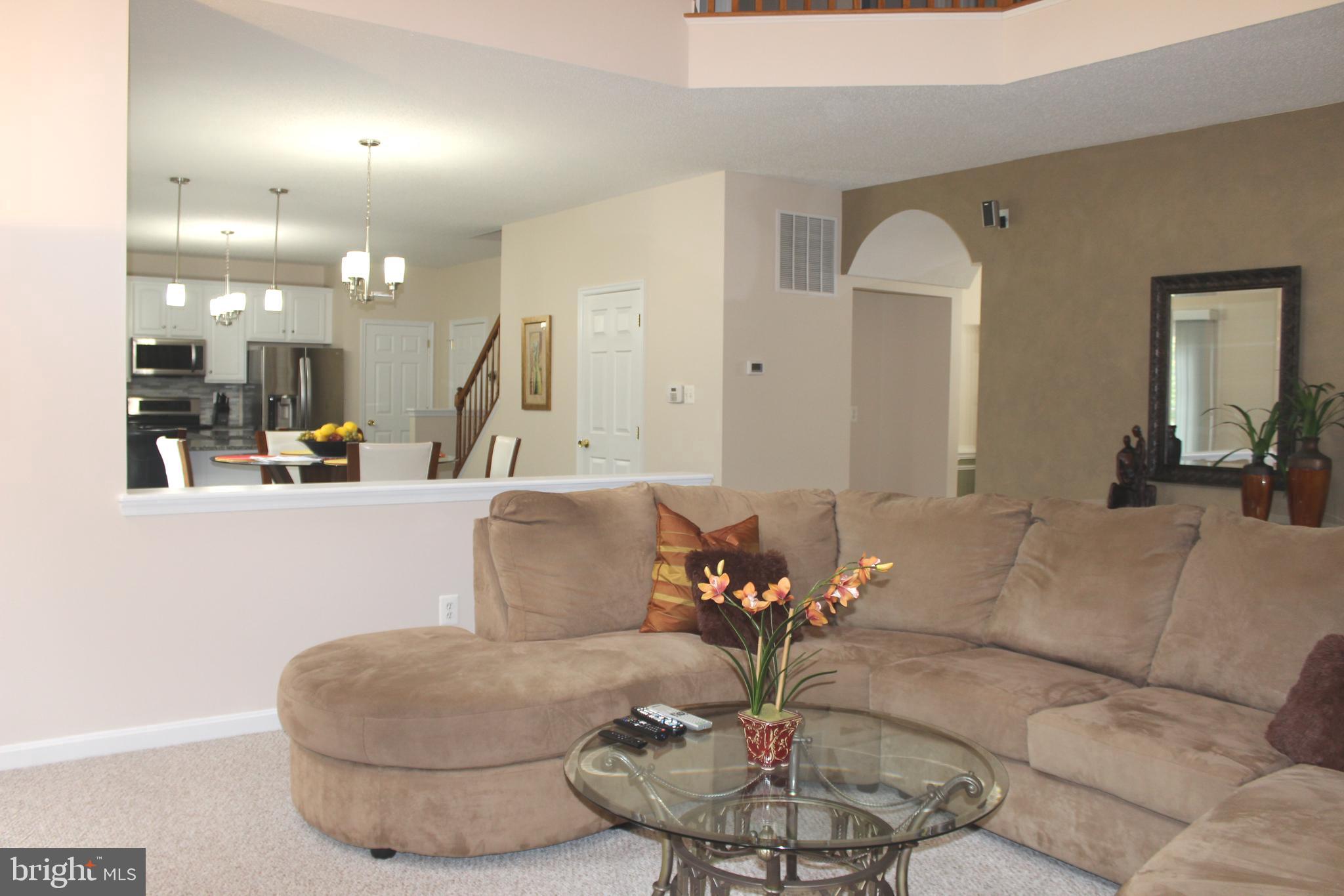 3470 Malcolm Road Brandywine, MD 20613 - Photo 21 of 55 a living room with furniture and a chandelier