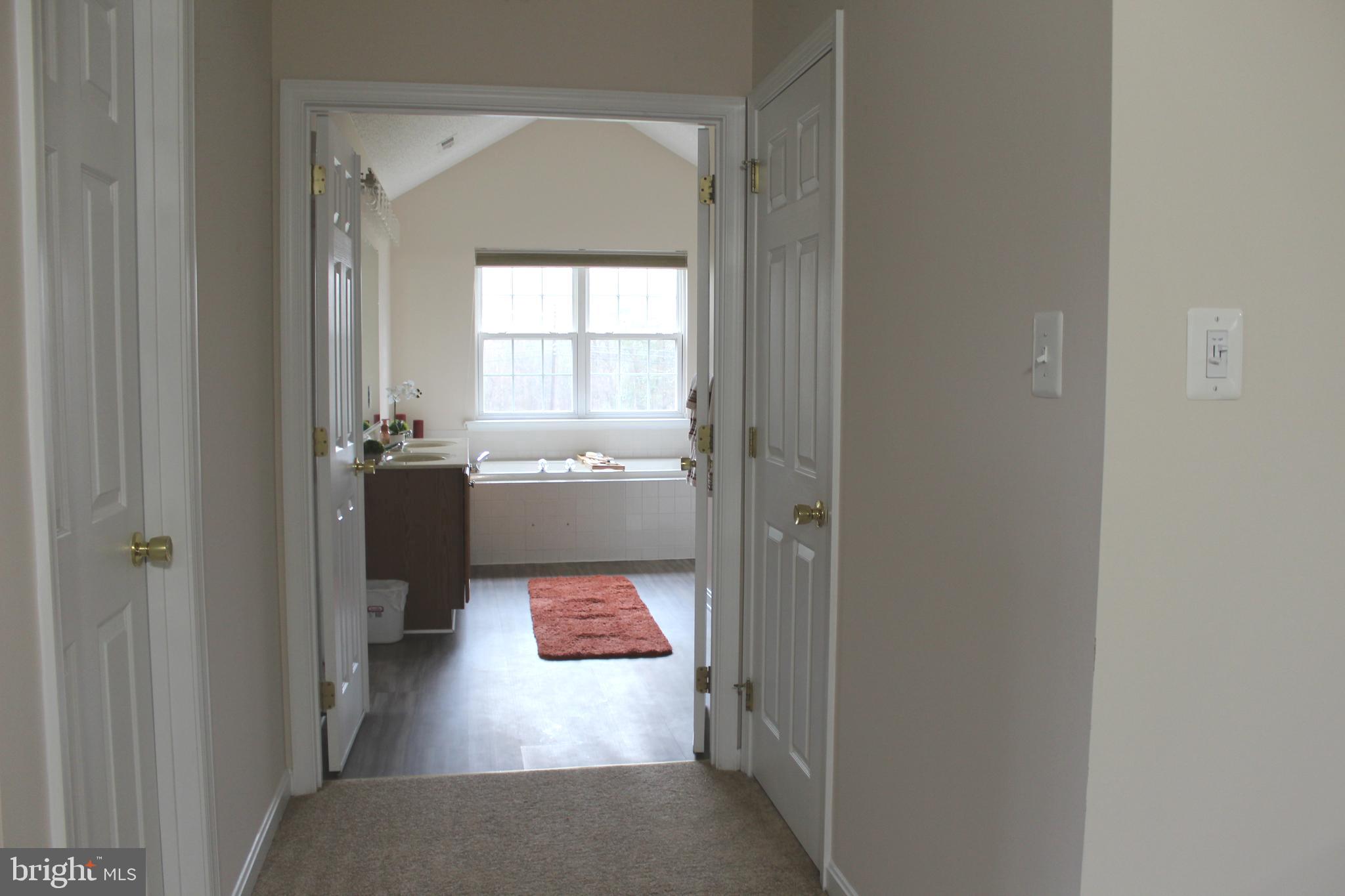 3470 Malcolm Road Brandywine, MD 20613 - Photo 27 of 55 a view of a hallway to a livingroom and a window