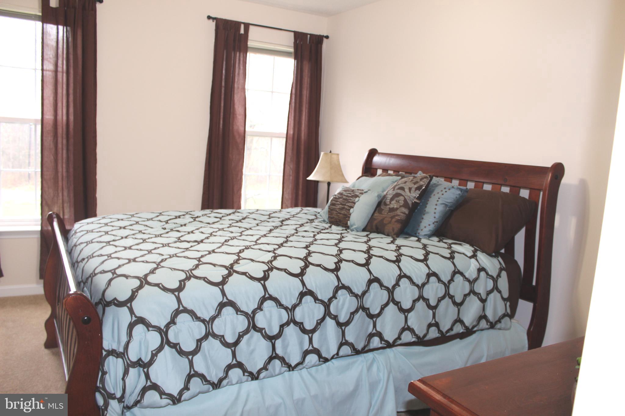 3470 Malcolm Road Brandywine, MD 20613 - Photo 34 of 55 a bedroom with a bed and a window