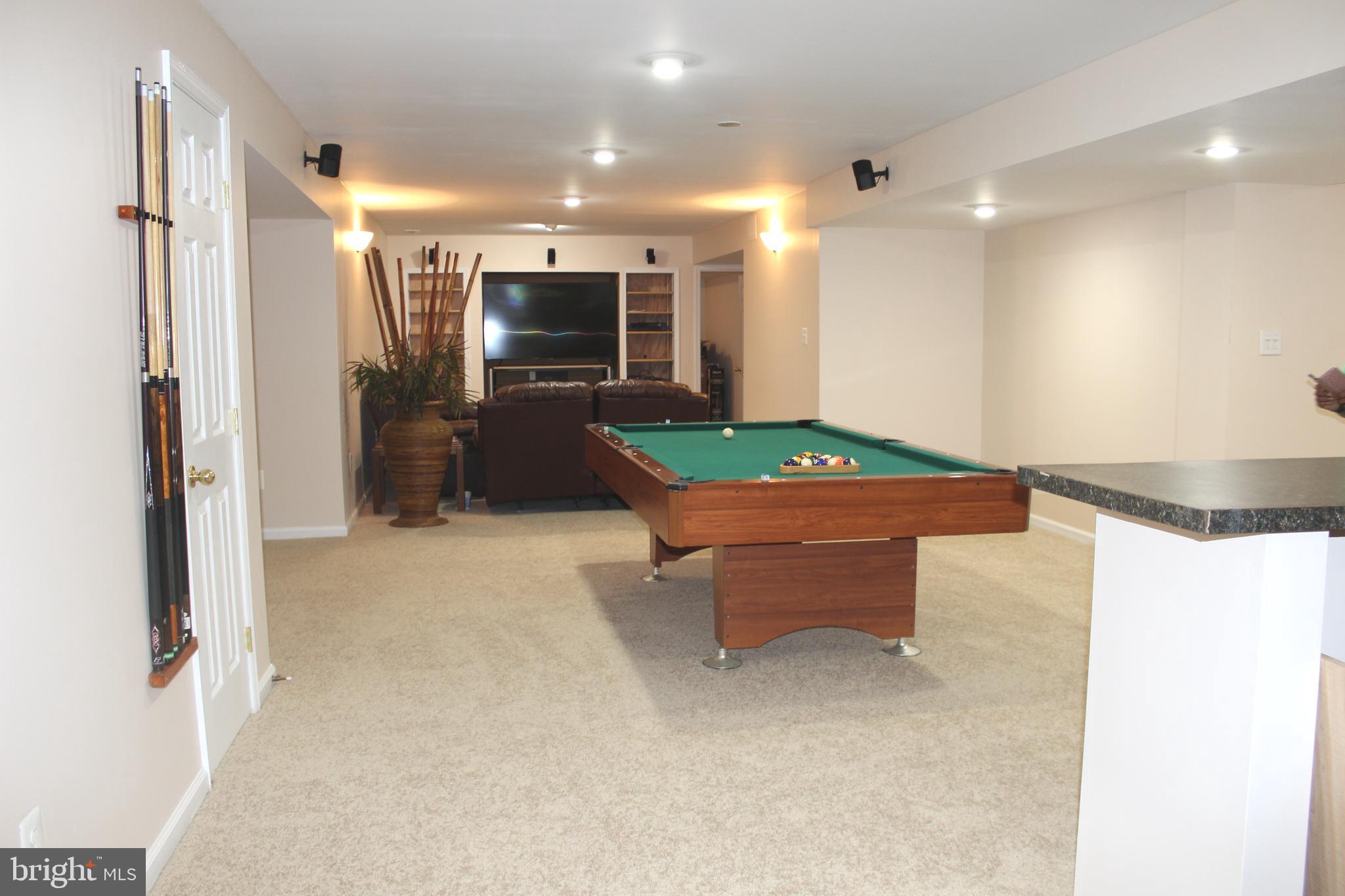 3470 Malcolm Road Brandywine, MD 20613 - Photo 40 of 55 a room with furniture and a flat screen tv