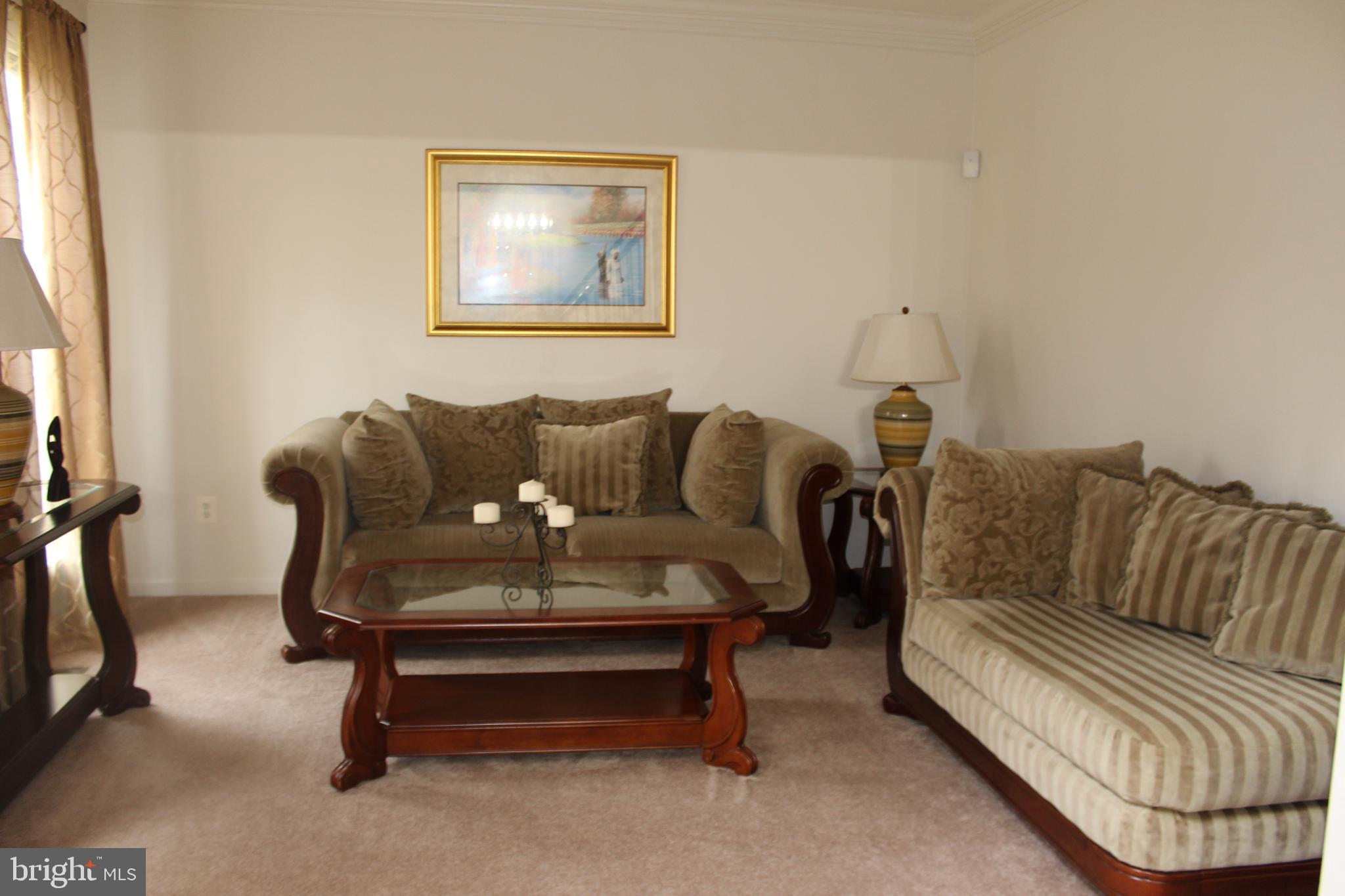 3470 Malcolm Road Brandywine, MD 20613 - Photo 52 of 55 a living room with furniture and a couch