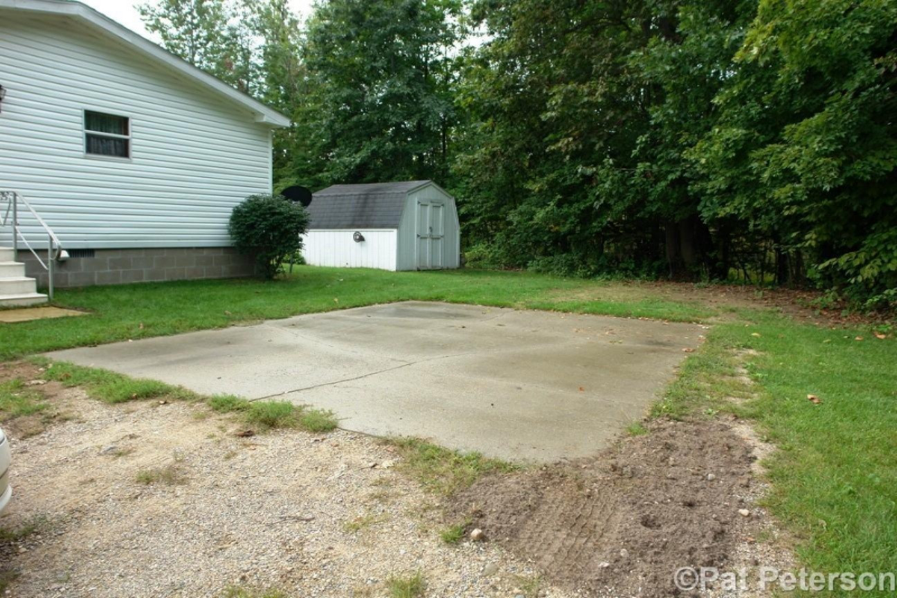 2131 West Hillis Road Stanton, MI 48888 - Photo 26 of 28 Cement Pad by Side door