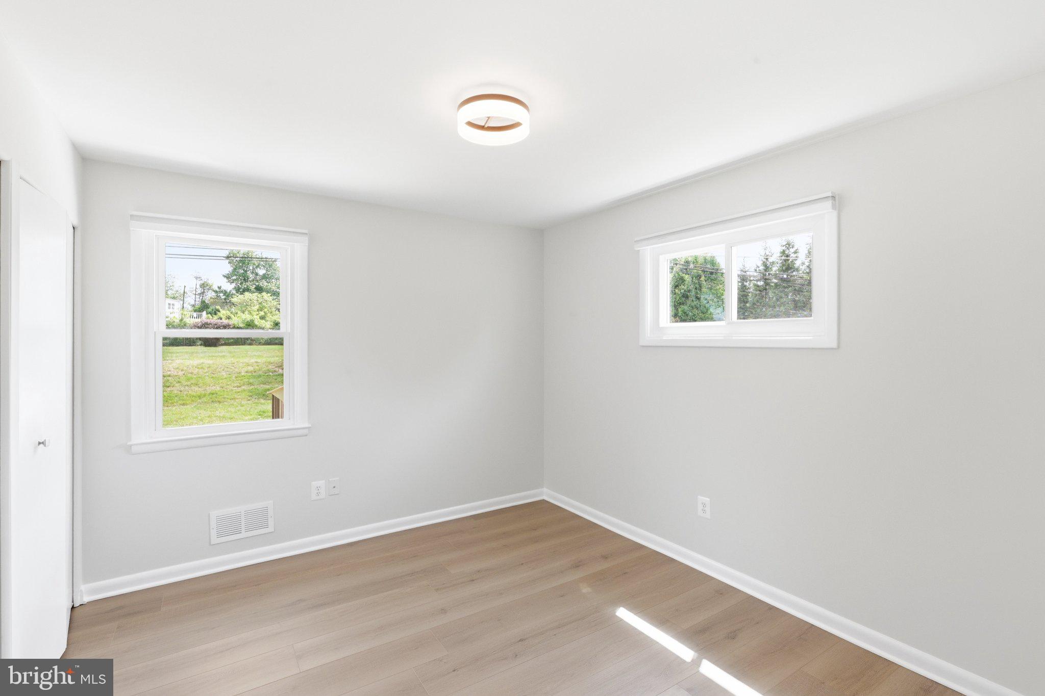 9005 Perring Park Road Baltimore, MD 21234 - Photo 9 of 20 an empty room with windows