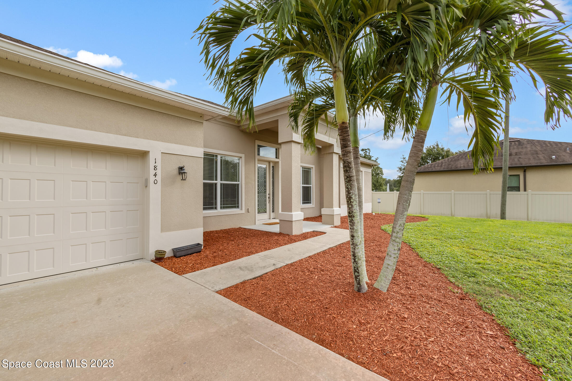 1840 Trimble Road Melbourne, FL 32934 - Photo 1 of 42 a front view of a house with garden