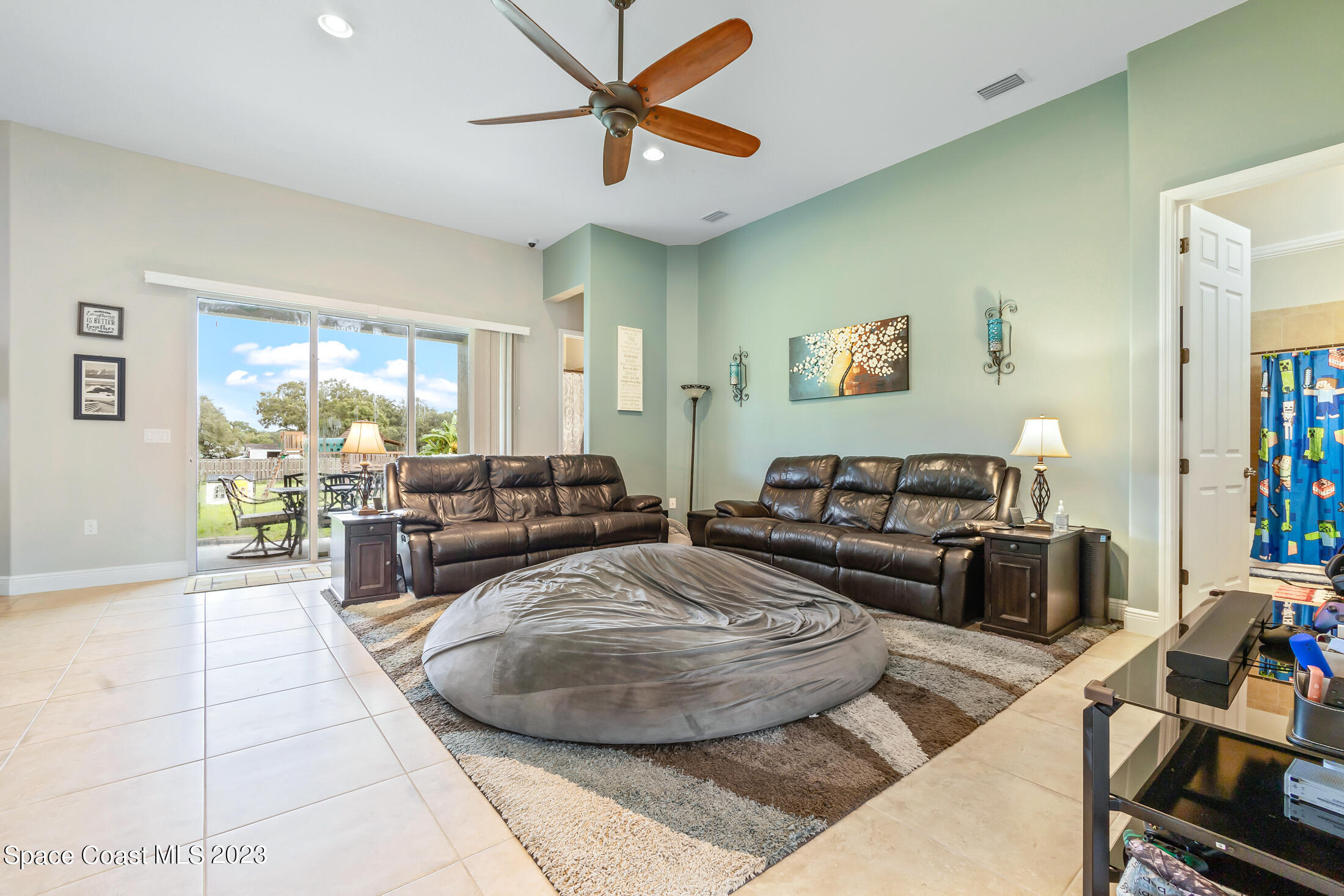 1840 Trimble Road Melbourne, FL 32934 - Photo 14 of 42 a living room with furniture and a large window